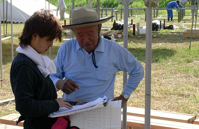 Ayako discussing with carpenter